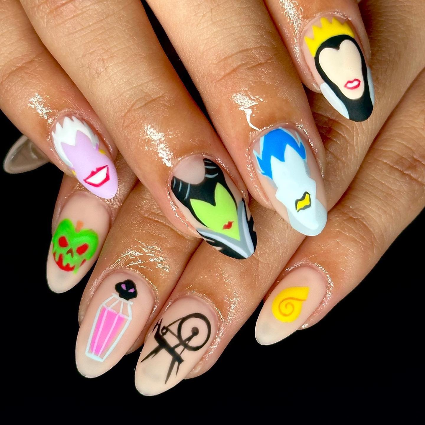 White Character Nails with Bright Pink, Green, Blue, and Yellow Accents