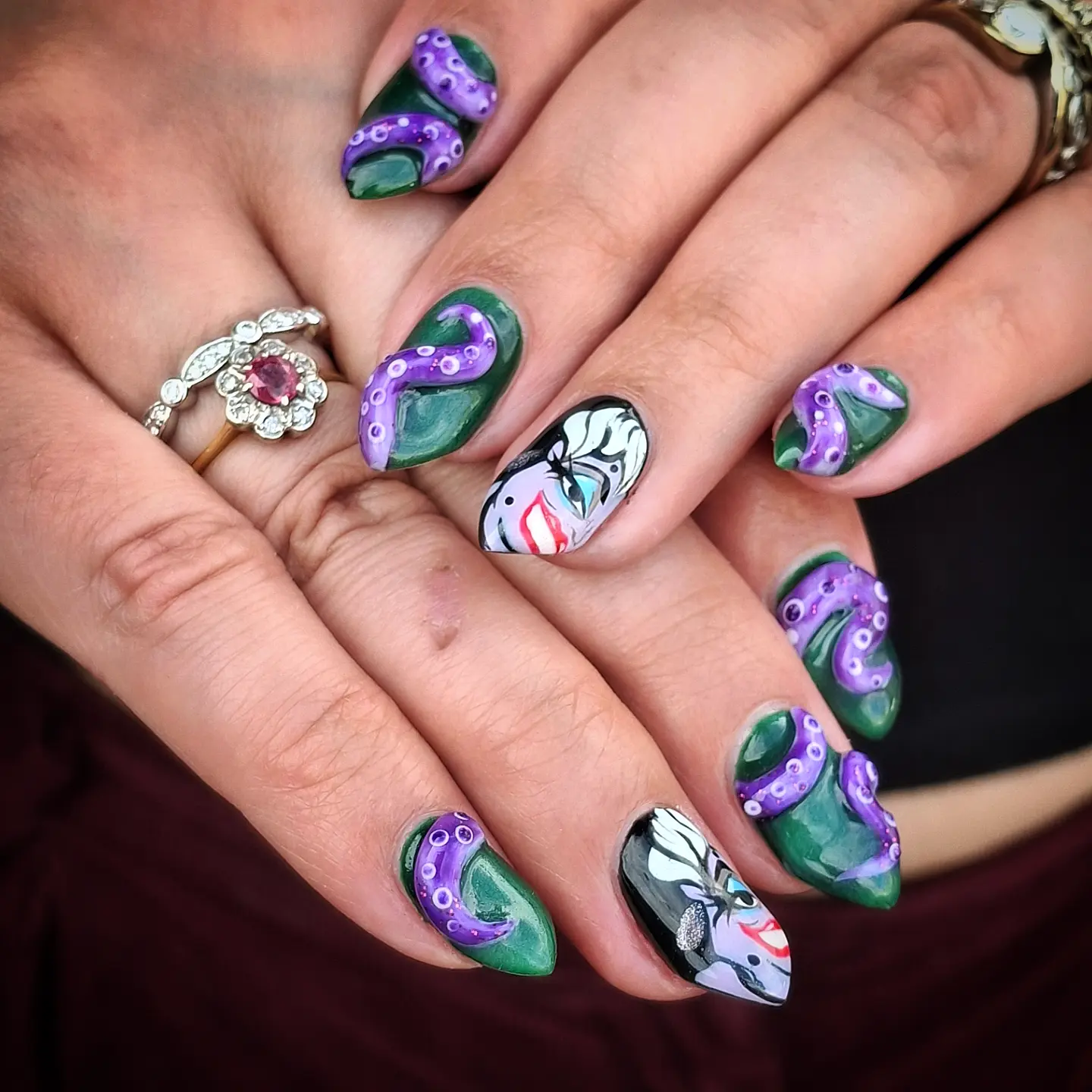 Colorful Character Nail Art with Purple, Green, Blue, and White