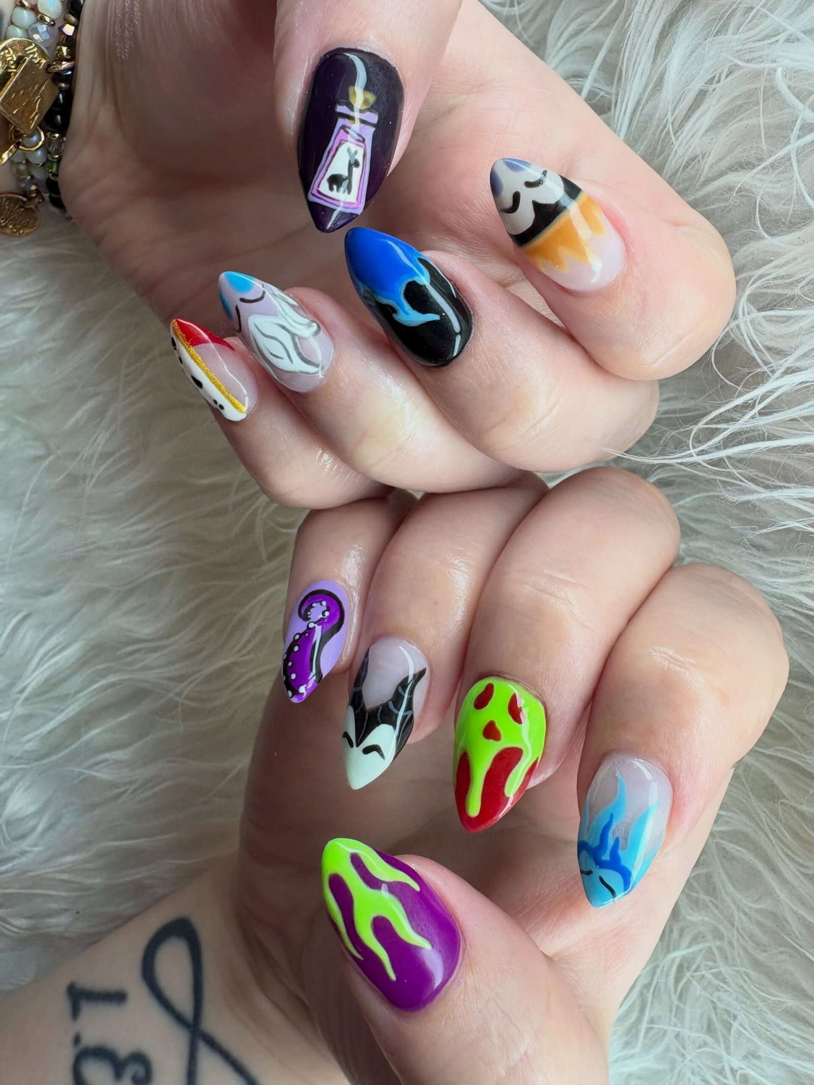 Long Purple and Black Nails with Gold and Silver Details