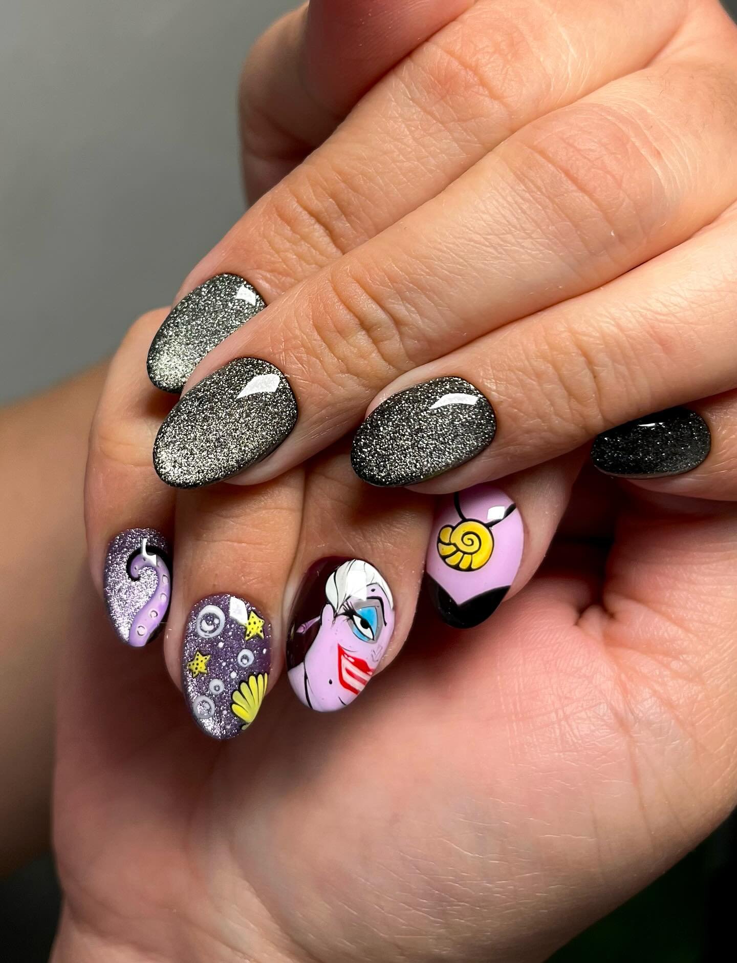 Black Glitter Nails with Colorful Character Accents