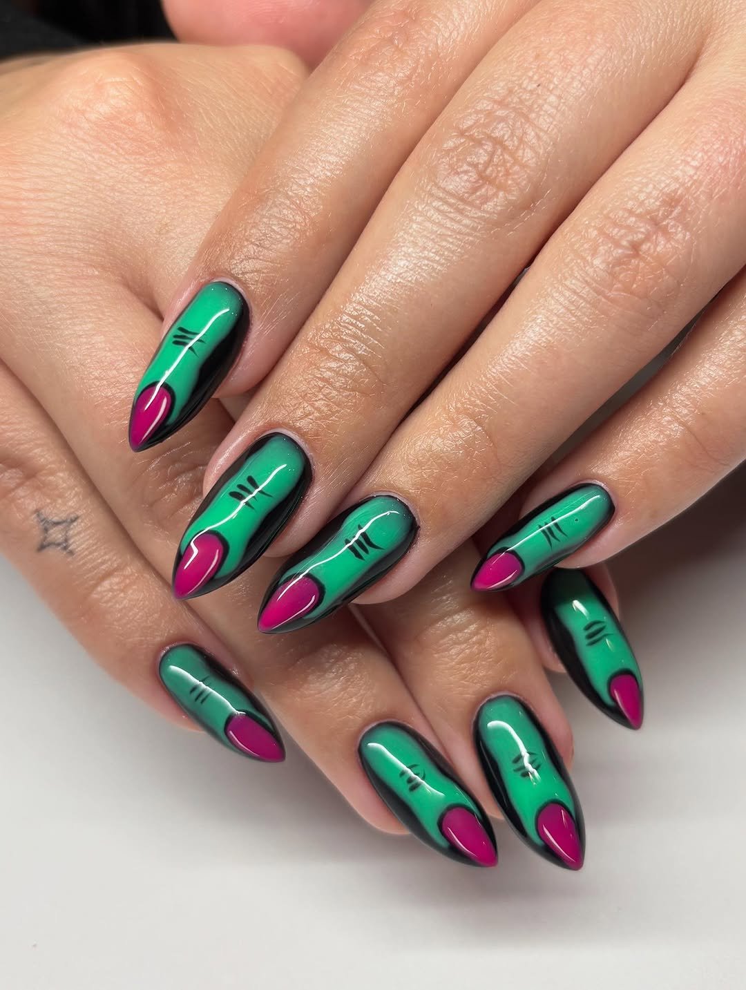 Glossy Emerald Green and Magenta Almond Nails