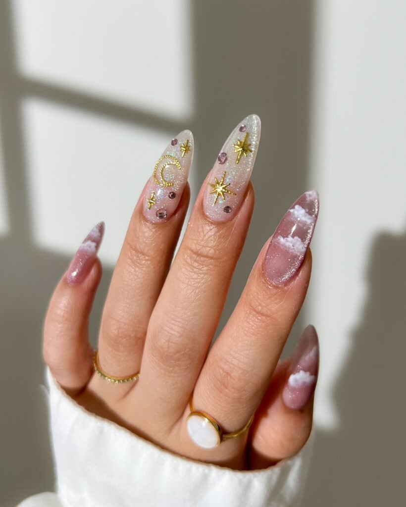 Sheer Pink Almond Nails with Gold Celestial Accents