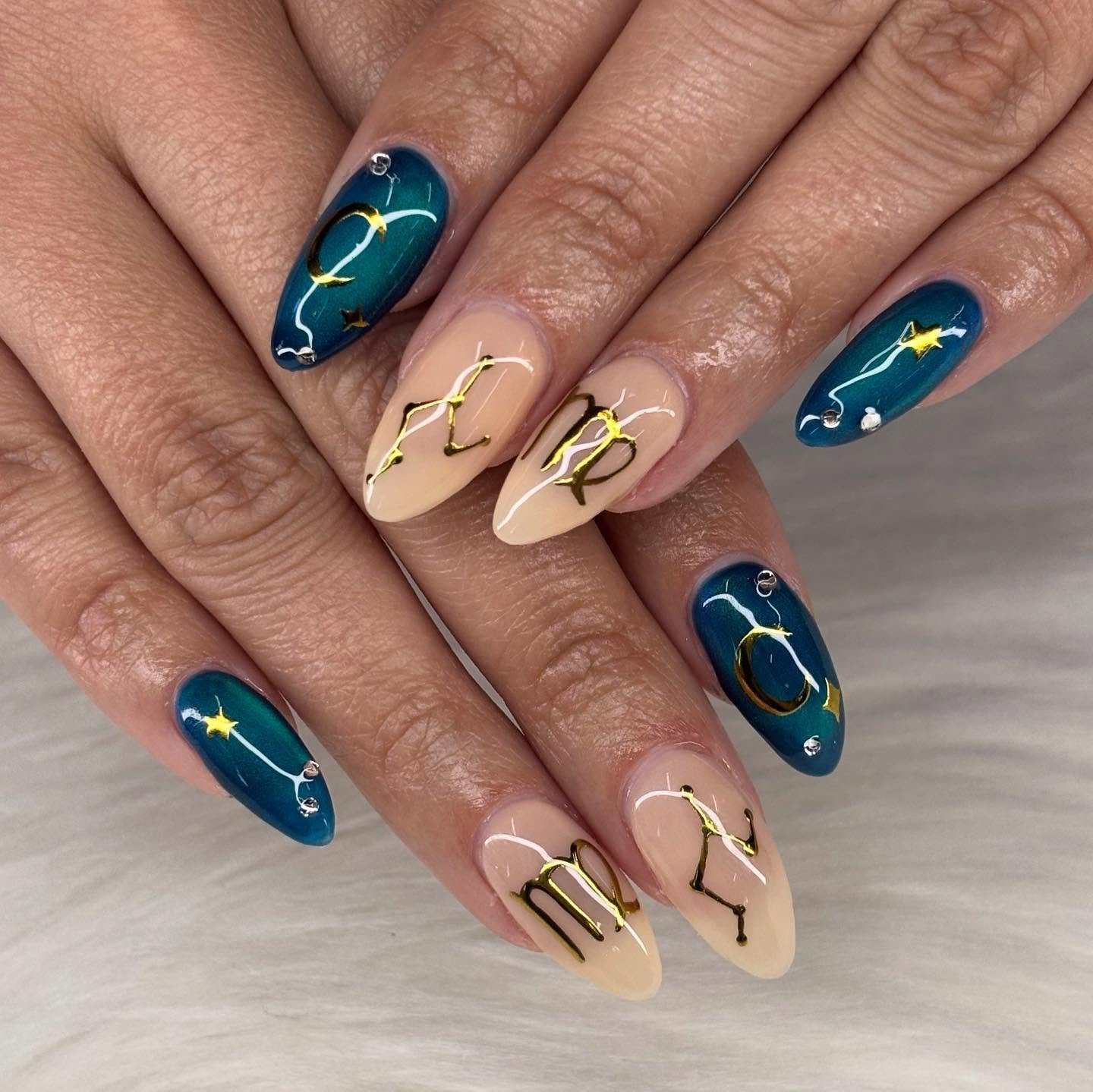 Teal and Nude Almond Nails with Gold Zodiac Details
