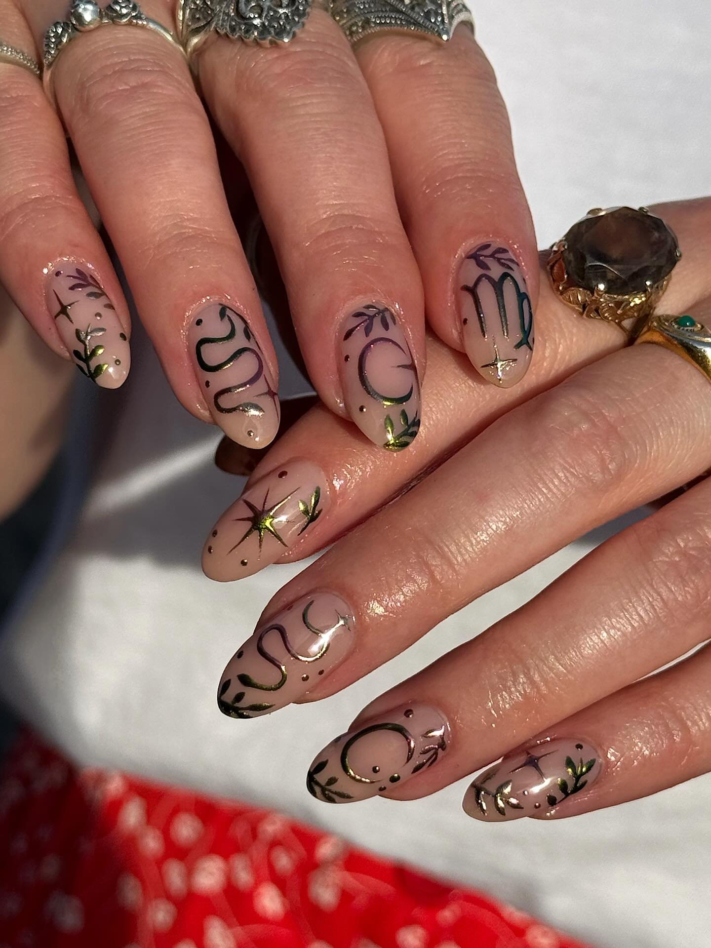 Nude Almond Nails with Black Line-Art Symbols