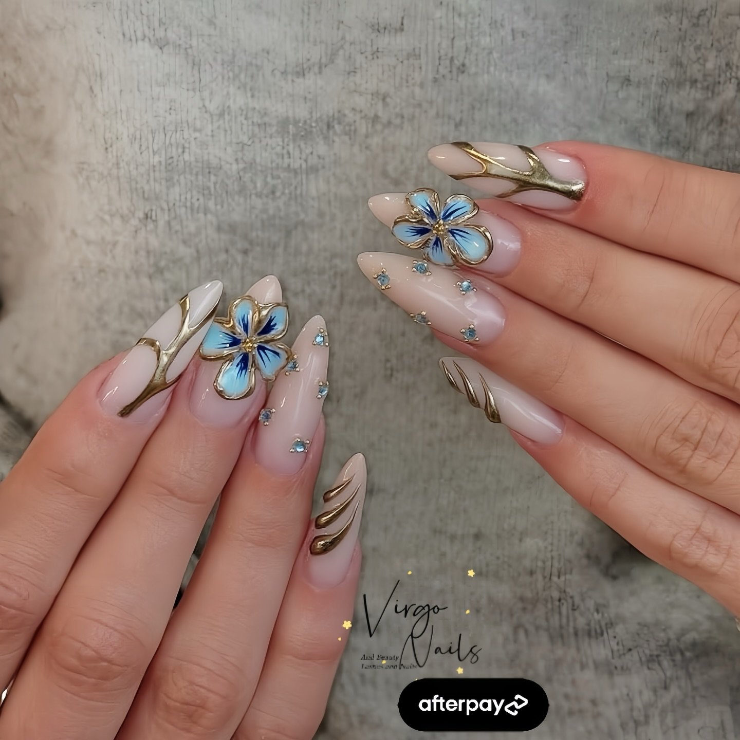 Nude Almond Nails with Blue and Yellow Floral Art