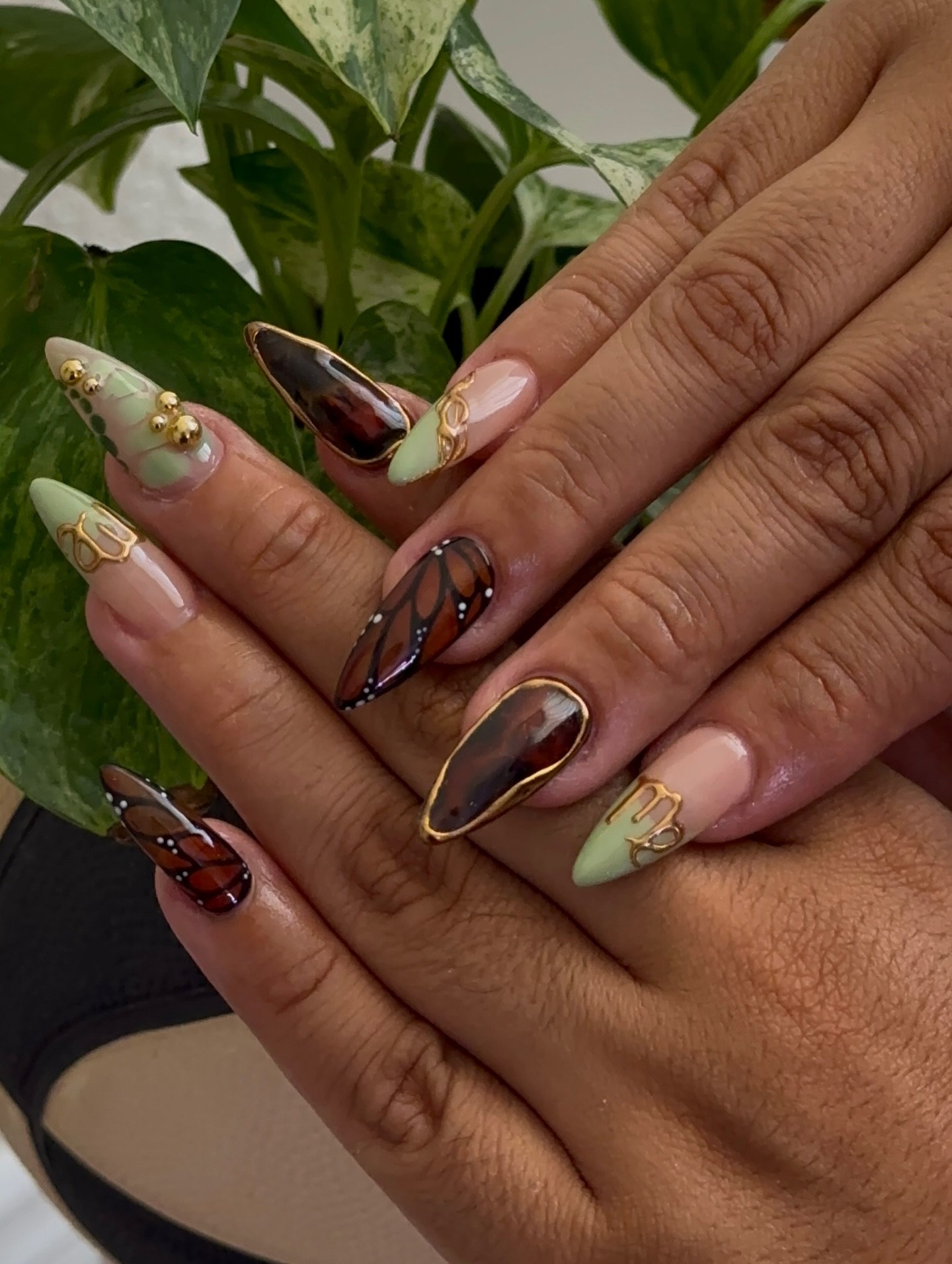 Earth-Toned Almond Nails with Abstract Gold Details