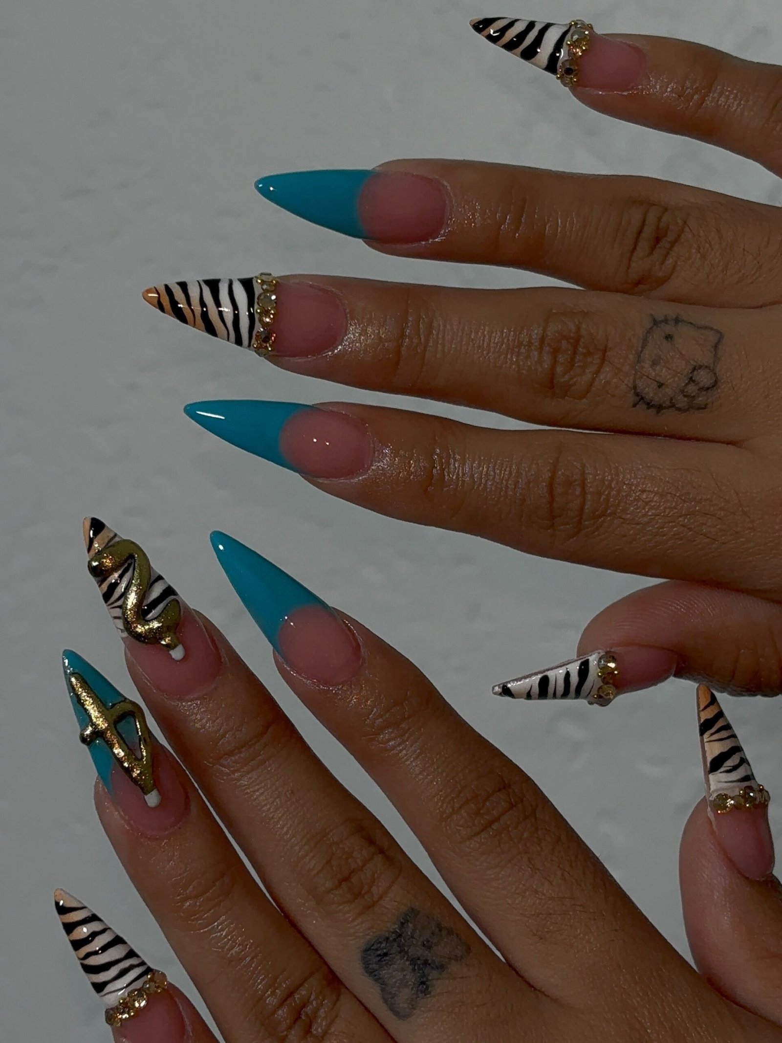 Blue and Cream Stiletto Nails with Zebra-Style Stripes