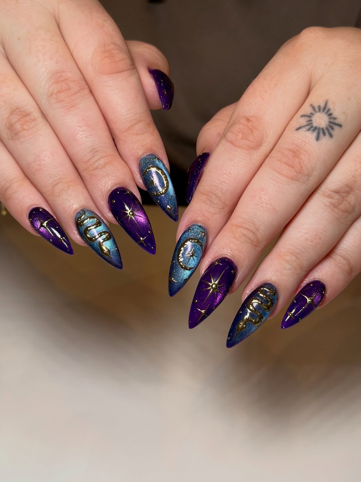 Deep Purple Stiletto Nails with Metallic Details