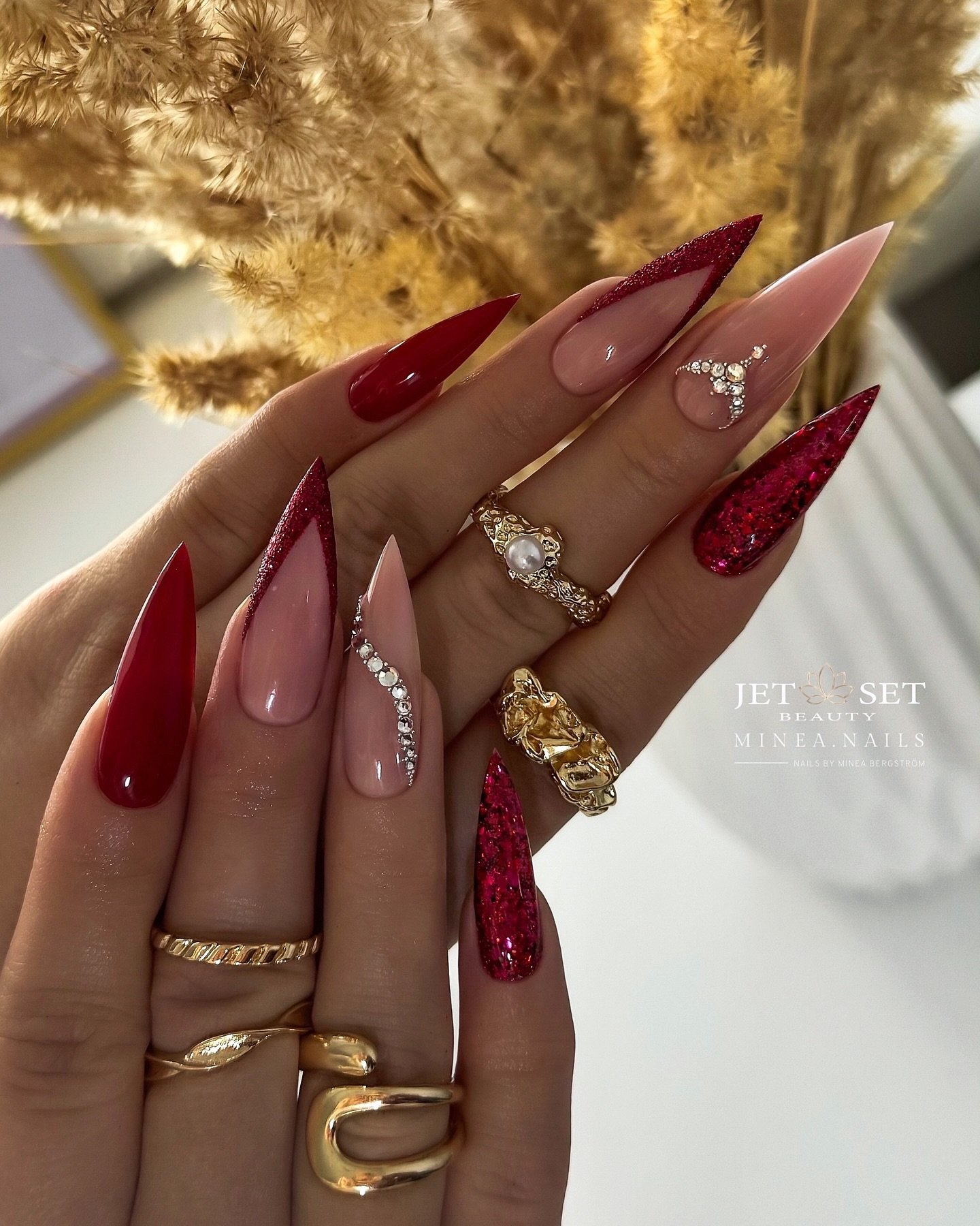 Long Wine Stiletto Nails with Nude and Glitter Accents