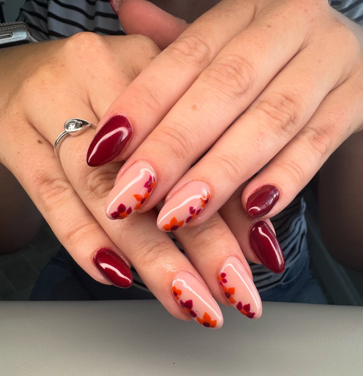 Wine Red Almond Nails with Soft Abstract Accents
