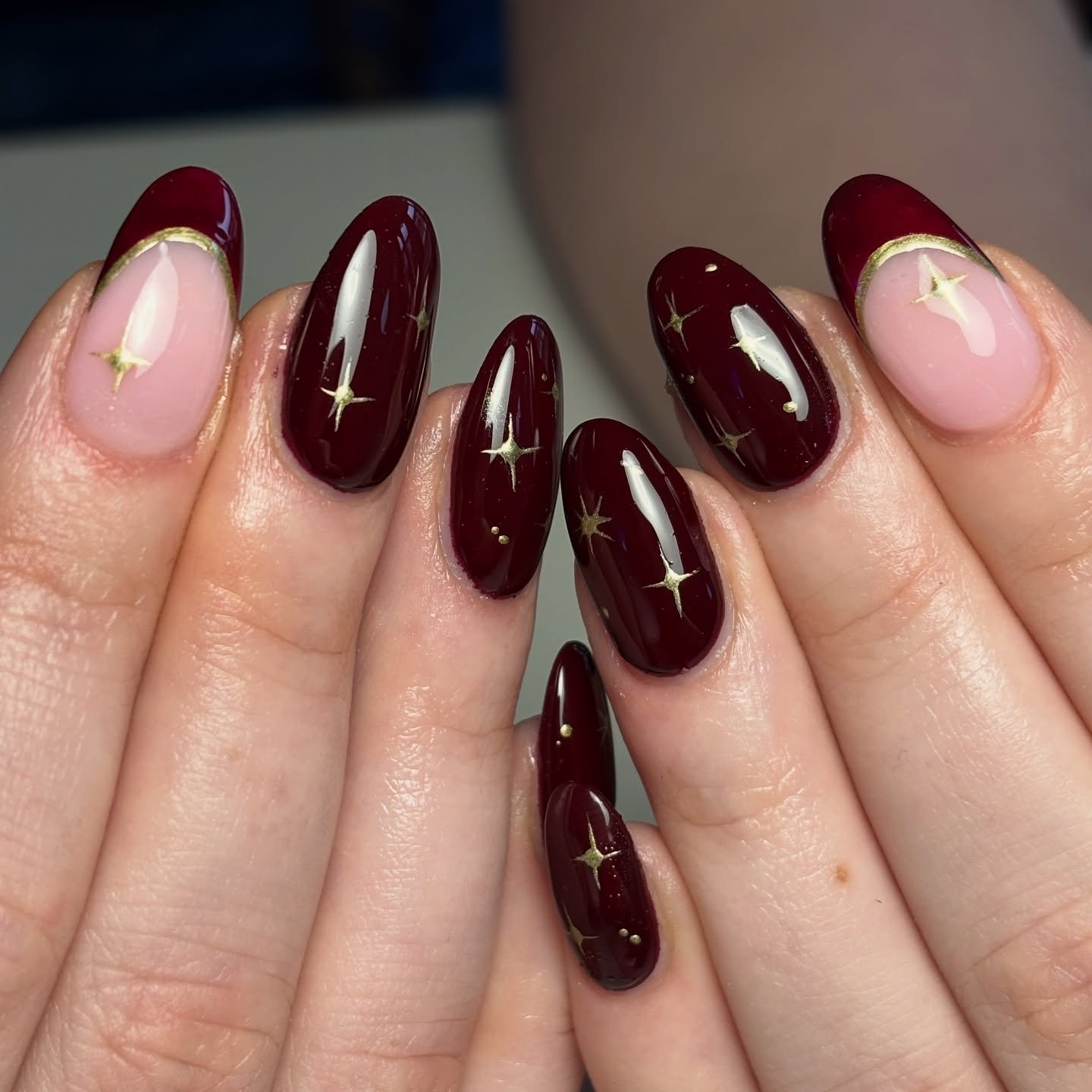 Wine Almond Nails with Tiny Gold Stars