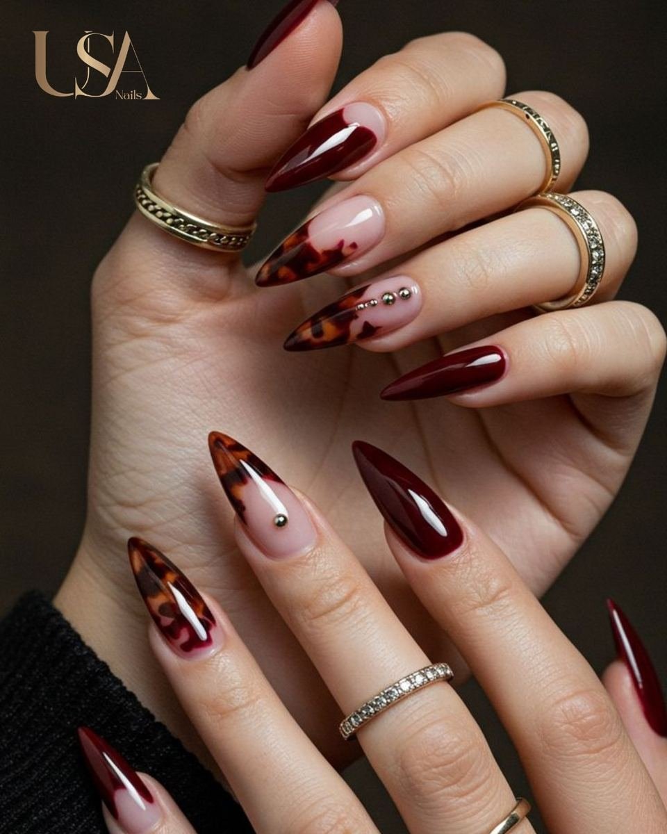 Wine and nude patterned almond nails