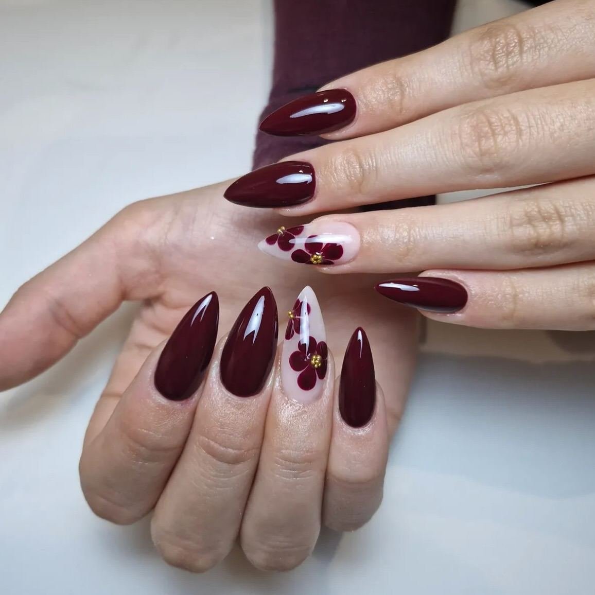 Wine and nude nails with tiny floral details