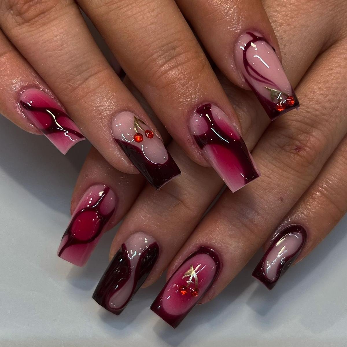 Short wine nails with tiny red accents